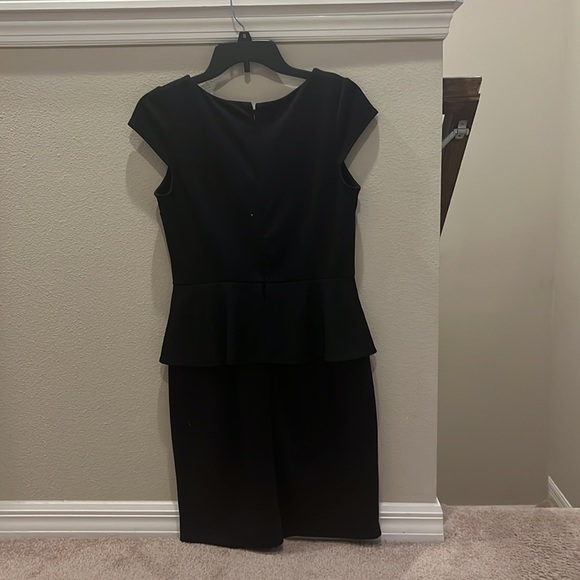 A black formal dress that is very plain and simple. Can be dressed up or down. - Picture 2 of 3